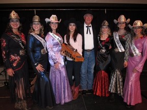 Flanked by Miss Rodeo Canada 2014 Nicole Briggs (left) and incoming MRC Katy Lucas (right), RBC Financial's Dave Majeski and grand-daughter McKayla show off his prize purchase at last weekend's Black Tie Bingo
