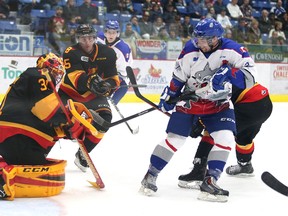 Sudbury Wolves newcomer Brook Hiddink looks for a rebound in front of Belleville Bulls goaltender Charlie Graham during first-period OHL action at Sudbury Community Arena on Saturday night. The Wolves erased a 6-3 third-period deficit to win 7-6 in overtime.
