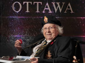Audrey Burleton (87) poses for a photo at the MacDonald Cartier International Airport in Ottawa Friday Nov 7,  2014.  Audrey has raised a large amount of money for the Legion selling poppies at the Ottawa Airport.  
Tony Caldwell/Ottawa Sun/QMI Agency