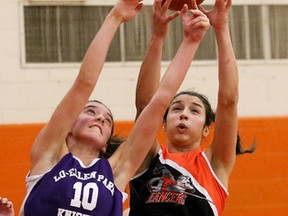 Lo-Ellen's Andrea Zulich (left) and Lasalle's Laura Graham battle for a rebound during the senior girls city championship at Lasalle on Saturday.
