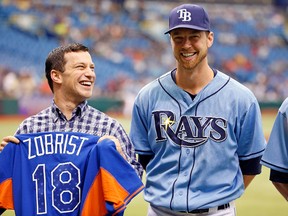 Infielder Ben Zobrist #18 of the Tampa Bay Rays smiles as he receives his all star jersey from Executive VP of Baseball Operations, Andrew Friedman just before the start of the game against the Houston Astros at Tropicana Field on July 14, 2013 in St. Petersburg, Florida. (J. Meric/Getty Images/AFP)
