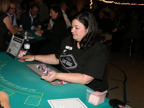 Amy Sarginson served as one of the many dealers at the United Way’s Viva Las Vegas casino night Saturday.