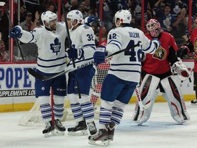 Maple Leafs players celebrate a goal against the Senators in Ottawa on Sunday night.(Tony Caldwell/QMI Agency)