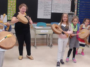 Photo supplied   
Grade 3 students at Ecole St-Augustin in Garson welcome First Nations drums presented by elders from the Atikameksheng Anishnawbek community.