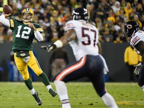 Green Bay Packers quarterback Aaron Rodgers (12) throws a 40-yard touchdown pass to wide receiver Jordy Nelson (not pictured) in the second quarter against the Chicago Bears at Lambeau Field on Nov 9, 2014 in Green Bay, WI, USA. (Benny Sieu/USA TODAY Sports)