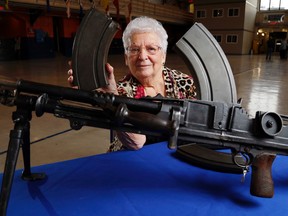 Evelyn Hurford of Belleville holds the magazine of a Bren light machine gun from the Hastings and Prince Edward Regiment Museum. Her job throughout much of the Second World War was welding the lugs on the magazines in the workshop of Toronto’s John Inglis Co.