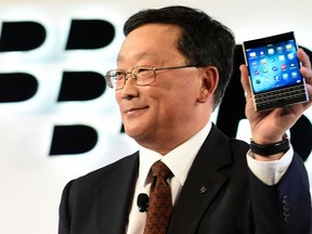 BlackBerry chief executive John Chen introduces the Passport smartphone during an official launch event in Toronto in this file photo taken Sept. 24, 2014.REUTERS/Aaron Harris/Files