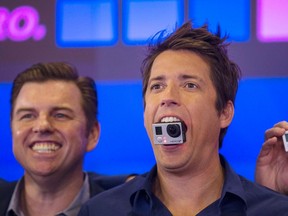 GoPro Inc's founder and CEO Nicholas Woodman holds a GoPro camera in his mouth at GoPro Inc's IPO at the Nasdaq Market Site in New York City in this file photo taken June 26, 2014. REUTERS/Mike Segar/Files
