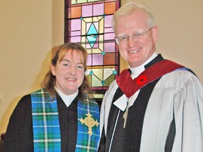 The Rev. Amanda Wickenheiser, a newly ordained Presbyterian minister, poses with the Rev. Robert Adams following her Service of Ordination at Knox Presbyterian Church in Mitchell last Sunday, Nov. 9. Wickenheiser became the first person to be ordained in the church's 165-year history. KRISTINE JEAN/MITCHELL ADVOCATE