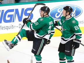 Dallas Stars left wing Antoine Roussel (L) has been fined by the NHL for landing a sucker punch against San Jose Sharks' Justin Braun. (REUTERS)