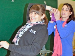 Tracey Phillips (left) and Lisa McDougall, of Perth Care For Kids, work together during an interactive workshop Nov. 5 at UTES. KRISTINE JEAN/MITCHELL ADVOCATE