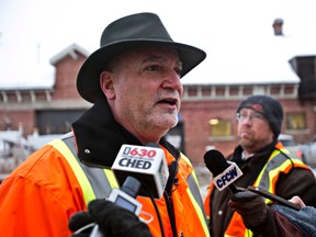 City roads boss Bob Dunford gives an update on the city's targeted parking ban at the main yard in Edmonton, Alta., on Monday, Jan. 6, 2014. A targeted parking ban is in place on specific collector and bus routes so crews can remove windrows. Codie McLachlan/Edmonton Sun