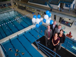 Mayor-elect Matt Brown, left, managing director of parks and recreation Bill Coxhead, London West MP Ed Holder, acting mayor Denise Brown and Lynn Lubert, division manager, stand on the 7.5-metre platform at the refurbished London Aquatic Centre.(MIKE HENSEN, The London Free Press)