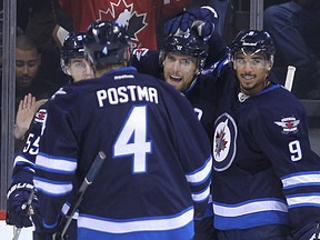 The Jets have had a lot to celebrate lately and want to keep this great roll they are on going. Kevin King/Winnipeg Sun/QMI Agency