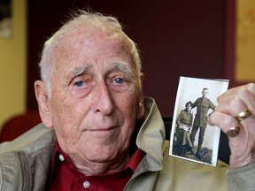 Dennis Curtis  with photos of his father who entered the First World War 100 years ago.  (Ian MacAlpine/The Whig-Standard)