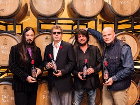 Tragically Hip band members Rob Baker, left, and Paul Langlois, second from right, along with Stoney Ridge Estate Winery Owner Bob McCown, second from left, and head winemaker Jeff Hundertmark  launch the Kingston band's signature wine Fully Completely.