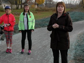 Robin Lynn Fleming, left, and Monica Smith of Citizens for Active Transportation stand with St. Thomas Mayor Heather Jackson Monday at the official opening of the new L&PS Corridor Trail. (Ben Forrest, Times-Journal)