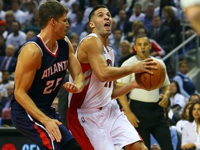 Raptors’ Greivis Vasquez drives the net against Atlanta Hawks’ Thabo Sefolosha earlier this season. Vasquez has been part of Toronto’s strong second unit. (DAVE ABEL/Toronto Sun)