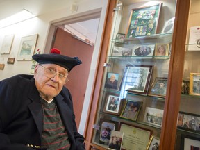 Albert Bruce Burton is 91 years old and is a resident at the Perley Rideau Centre. He served in World War Two heading off the battle when he was 17. He was wounded in the Battle at Normandy when a shell exploded behind him. He is shown here in front of a display that includes some of his army memorabilia, photos and medals.
DANI-ELLE DUBE/OTTAWA SUN/QMI AGENCY