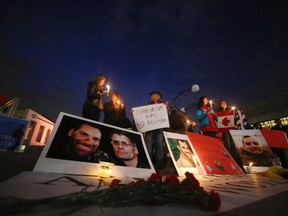 A candlelight vigil is held for Warrant Officer Patrice Vincent and Corporal Nathan Cirillo. (REUTERS)