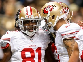 San Francisco 49ers wide receiver Anquan Boldin (81) celebrates with quarterback Colin Kaepernick (7) after scoring a touchdown against the New Orleans Saints during the second quarter at Mercedes-Benz Superdome. (Derick E. Hingle-USA TODAY Sports)