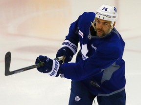 Daniel Winnik taok to the ice early during Leafs practice at the MasterCard Centre on Tuesday, Nov. 11, 2014. (DAVE ABEL/Toronto Sun)