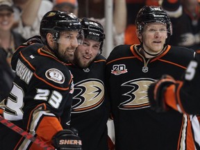 Anaheim Ducks Francois Beauchemin (23), Matt Beleskey (39) and Corey Perry (10) celebrate a goal against the Los Angeles Kings during the 2014 Stanley Cup playoffs at Honda Center on May 3, 2014 in Anaheim. (Jeff Gross/Getty Images/AFP)