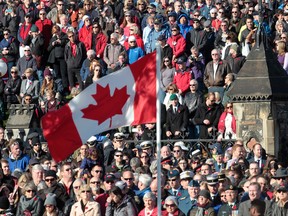 Thousands of people gathered to show their support during a Remembrance Day ceremony at the National War Memorial in Ottawa on Tuesday Nov 11,  2014.  Tony Caldwell/Ottawa Sun/QMI Agency