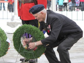 Local veteran Frank Newberry lays a wreath during the 2014 Remembrance Day ceremony held at the Drayton Valley cenotaph.