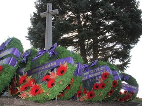 Wreaths surround the Cross of Sacrifice during a civic Remembrance Day ceremony in Kingston in 2014.MICHAEL LEA THE WHIG-STANDARD