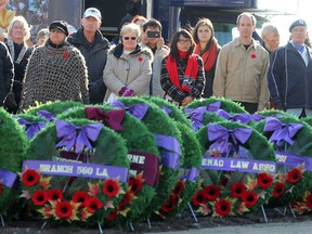 A larger crowd than usual was present at the Cross of Sacrifice during a civic Remembrance Day ceremony in Kingston Tuesday morning. TUES., NOV. 11,2014 KINGSTON, ONT. MICHAEL LEA THE WHIG STANDARD QMI AGENCY