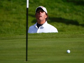 U.S. player Phil Mickelson chips onto the 18th green during his Ryder Cup match at Gleneagles in Scotland September 26, 2014.      (REUTERS/Eddie Keog)