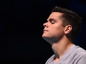 Milos Raonic of Canada reacts during his match against Andy Murray of Britain during their tennis match at the ATP World Tour finals at the O2 Arena in London November 11, 2014. (REUTERS/Toby Melville)