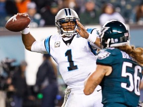 Carolina Panthers quarterback Cam Newton (1) throws the ball past rushing Philadelphia Eagles linebacker Bryan Braman (56) during the second half at Lincoln Financial Field Monday night. (Bill Streicher/USA TODAY Sports)