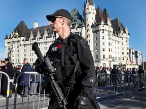 Security was tight during a Remembrance Day ceremony at the National War Memorial in Ottawa on Tuesday Nov 11,  2014. Thousands of people gathered at the National War Memorial to take part in the National Remembrance Day Ceremony. Tony Caldwell/Ottawa Sun/QMI Agency
