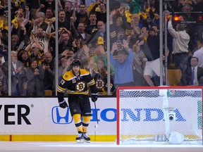 Boston Bruins left wing Milan Lucic reacts after scoring an empty net goal during the third period against the Montreal Canadiens in Game 2 of the second round of the 2014 NHL Playoffs at TD Banknorth Garden on May 3, 2014. (Bob DeChiara/USA TODAY Sports)