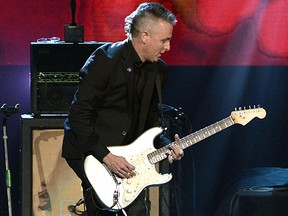 Mike McCready of Pearl Jam performs the National Anthem at T