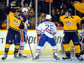 The Predators celebrate a first-period goal against the Oilers on Tuesday in Nashville. (USA TODAY)