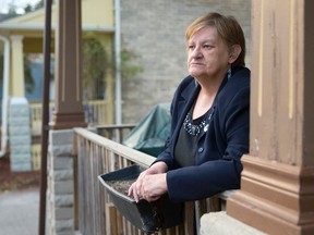 Charlene Finch, whose daughter Jenny was among those living in an Oxford St. E. group home run by Keith Charles that was closed following a fire, stands on the front porch of her home in London on Tuesday November 11, 2014. (CRAIG GLOVER, The London Free Press)