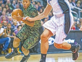 Raptors guard Kyle Lowry drives to the basket during Tuesday night's game against the Orlando Magic. (ERNEST DOROSZUK/Toronto Sun)