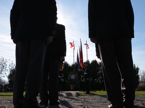 Veterans stand in rank at Tuesday's Remembrance Day ceremony held by the Capt. Matthew J. Dawe Memorial Branch 631 of the Royal Canadian Legion. (Elliot Ferguson/The Whig-Standard)