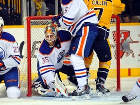 Oilers goalie Viktor Fasth faced heavy traffic around his net during the first period Tuesday in Nashville. (USA TODAY SPORTS)