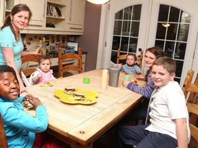 Gino Donato/The Sudbury Star
Dr. Julie Connolly feeds her children, Thnadeka, Neave, Finn, Naomi and Nathan on Tuesday. Connolly recently had her electricity disconnected by GSU for paying her bill late.