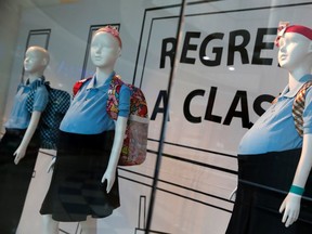 Mannequins of pregnant schoolgirls are seen in a shop window at a shopping mall in Caracas November 12, 2014. (REUTERS/Carlos Garcia Rawlins)
