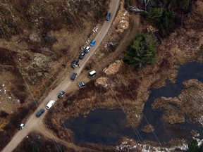 OPP investigate the scene in a remote area near Hay Lake in Algonquin Park where a Cessna 150 crashed, killing both occupants on Wednesday November 12, 2014. (Dave Abel/Toronto Sun)