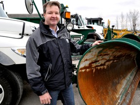John Parsons, manager of transportation and roadside operations, next to some of the city’s snow removal equipment in London Ont. Nov. 12, 2014. CHRIS MONTANINI\LONDONER\QMI AGENCY