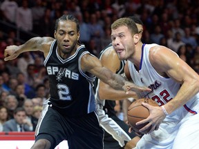 Los Angeles Clippers forward Blake Griffin (right) is fouled by San Antonio Spurs forward Kawhi Leonard in the fourth quarter of their game at Staples Center. (Jayne Kamin-Oncea/USA TODAY Sports)
