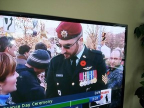 A uniformed man using the name Franck Gervais is interviewed by CBC during Tuesday's Remembrance Day ceremony at the National War Memorial in Ottawa.  CBC SCREEN GRAB/SUPPLIED