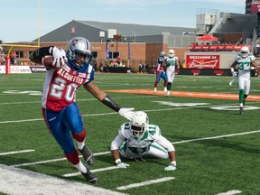 Tyrell Sutton of the Montreal Alouettes gets out of bounds during a game against the Saskatchewan Roughriders at Percival Molson Stadium in Montréal on Oct. 13, 2014. (PIERRE-PAUL POULIN/QMI Agency files)