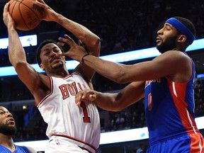 Bulls guard Derrick Rose is fouled during a game against Detroit. (USA TODAY SPORTS)